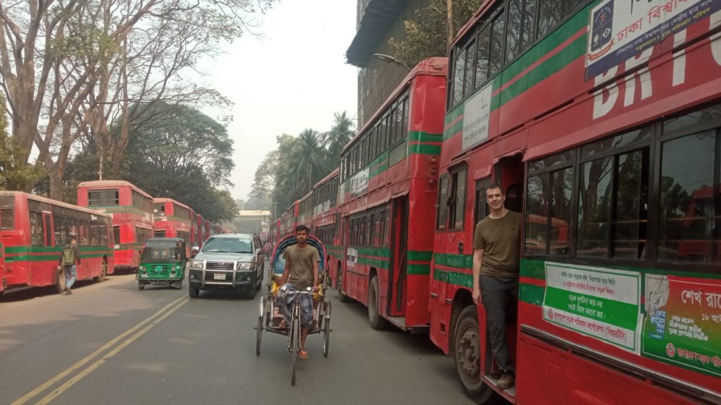 Tourist from Switzerland in Bangladesh experiencing Dhaka University shuttle bus.