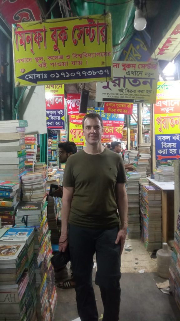 Switzerland tourist visiting book shops in Dhaka, Bangladesh.